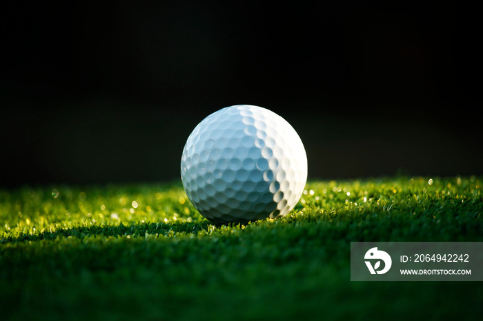 Golf ball on green in beautiful golf course at bokeh background. Golf equipment on green in golf cou