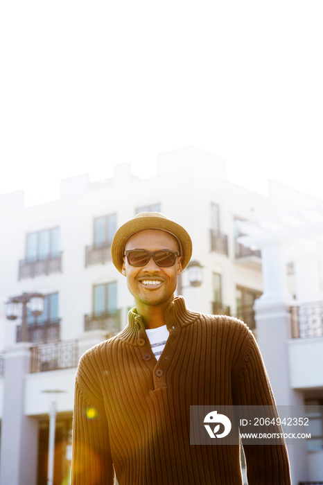 Young man smiling in sunshine