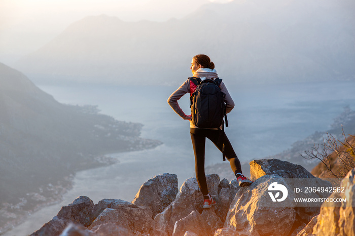 Young photographer on the top of mountain