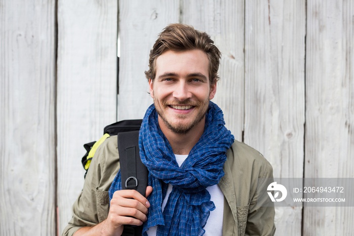 Young man carrying backpack