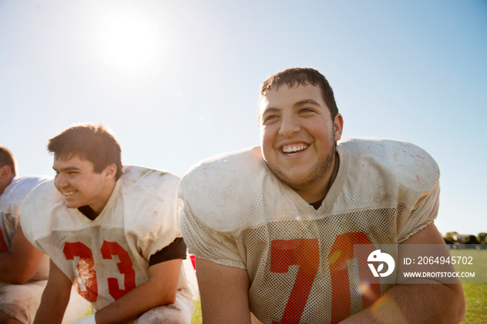 Young american football players smiling