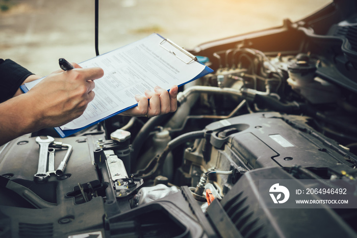 Car mechanic repairing vehicle engine working job.