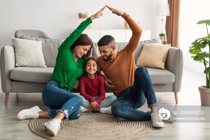 Arab parents making symbolic roof of hands above their daughter