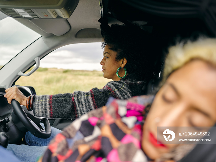 Women driving and sleeping in car