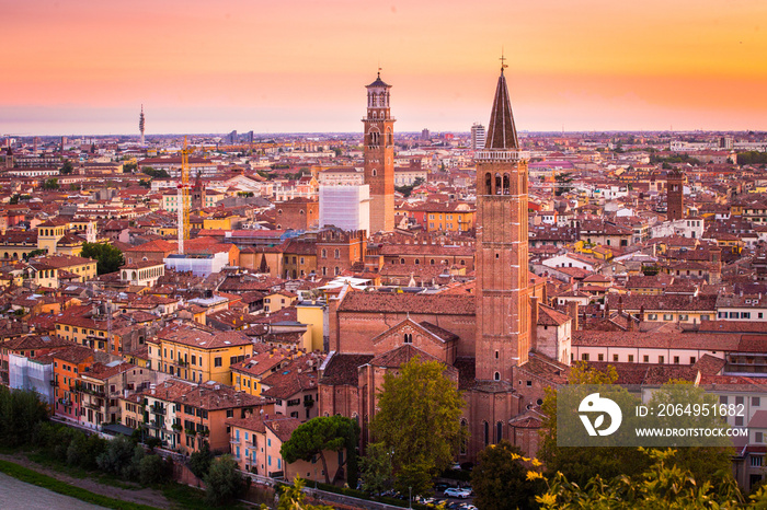 Aerial view of Verona city night cityscape and Church Santa Anastasia, with  Adige river , located i