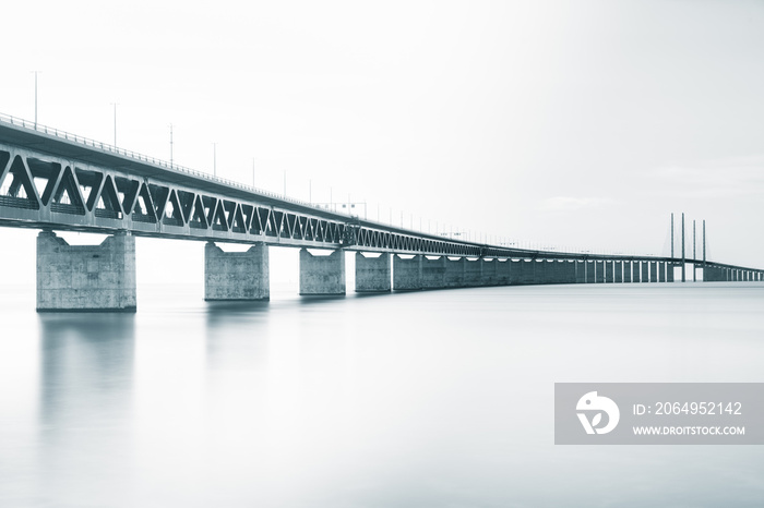 Long bridge over the sea on a cloudy day