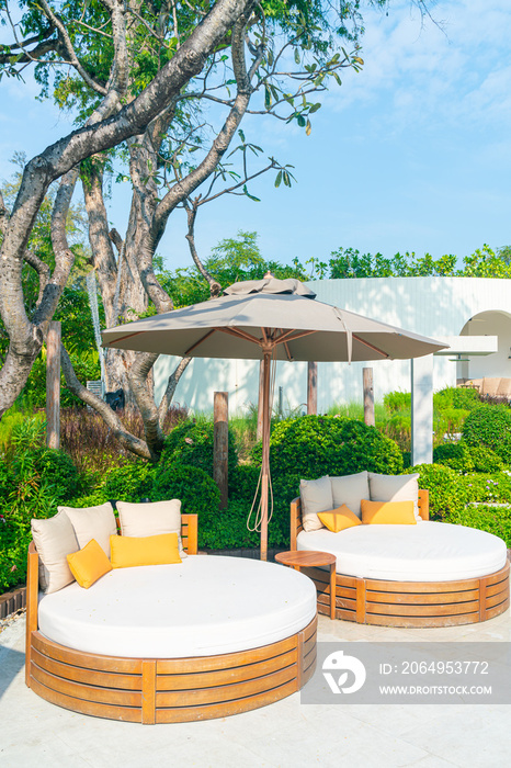 pillows on outdoor patio chair with umbrella