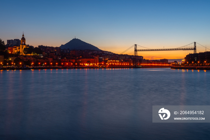 Panorama of Portugalete and Getxo with Hanging Bridge of Bizkaia at dusk from La Benedicta pier, Bas