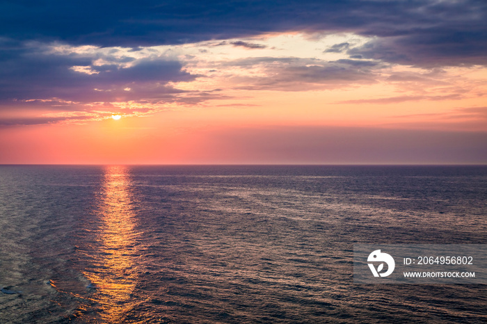 Dynamic dusk over calm ocean in summer, Baltic sea