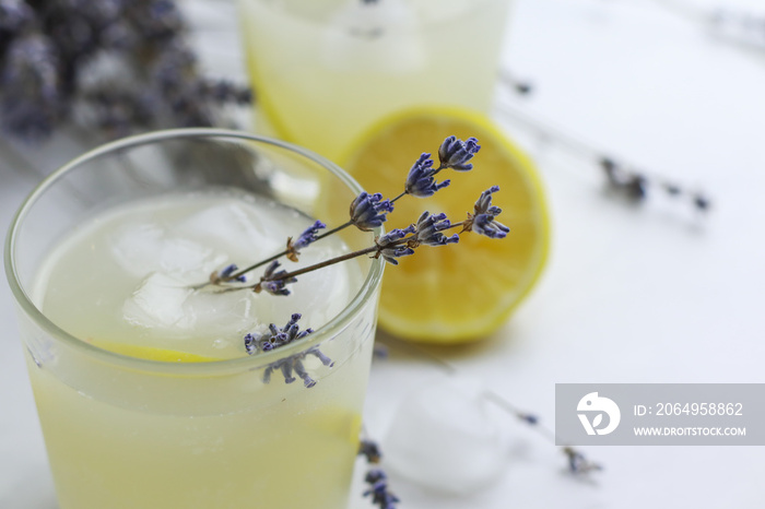 Tasty homemade lavender lemonade on light background