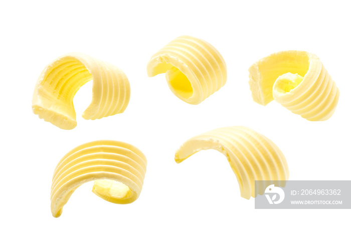 different butter curls or rolls isolated on white background.