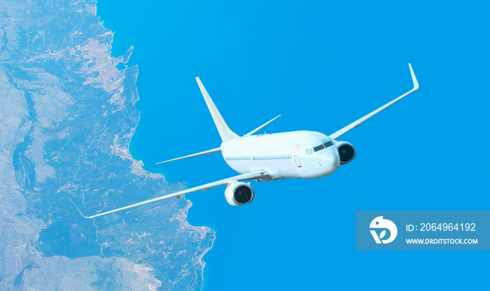 An airplane is flying over low clouds and city with blue sky