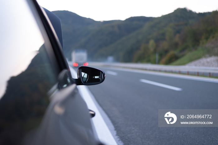 Black car stoed and parked on highway road. Roadside assistance concept