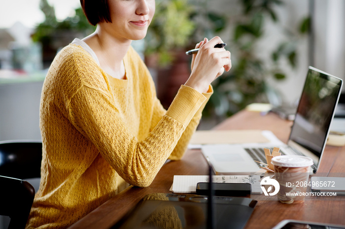 Woman working in her home office