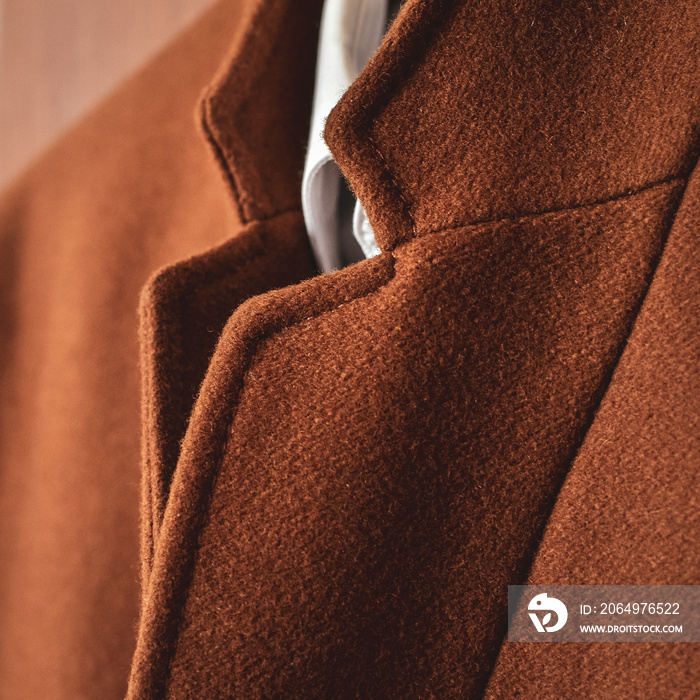 Close up of brown woolen coat with a collar fragment