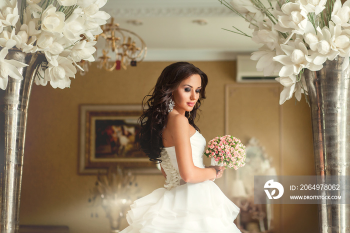 Bride in white wedding dress in luxury place