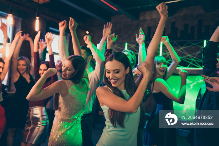 Portrait of positive cheerful elegant girlfriends crowd people celebrate noel party dance on discoth