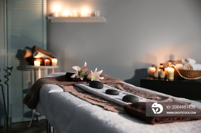 Interior of modern massage room in candle light