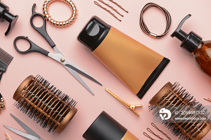 Set of hairdresser tools and accessories on color background