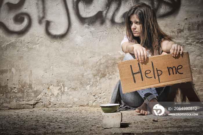 Poor woman begging for help on the  street