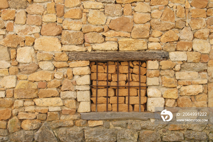 Window blinded with mud bricks in an abandoned house in Colmenares de Ojeda, north of Palencia provi