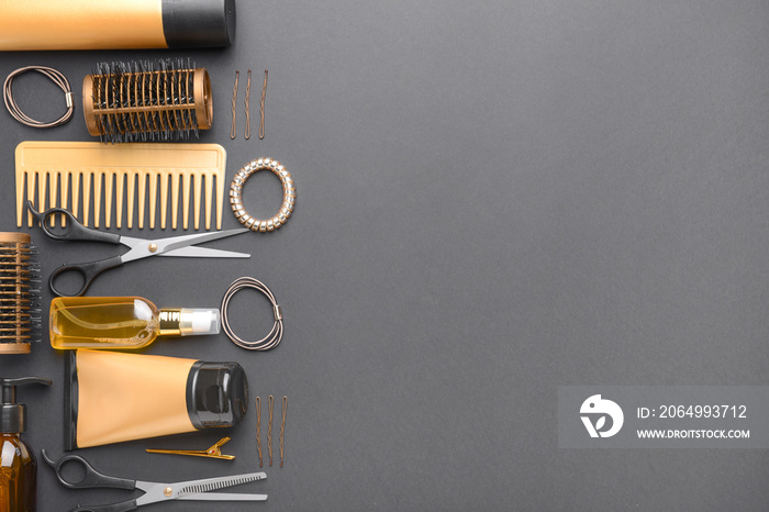 Set of hairdresser tools and accessories on dark background