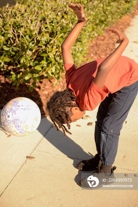 child playing with foot ball