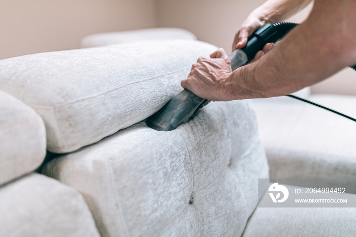 Process of deep furniture cleaning, removing dirt from sofa. Washing concept.