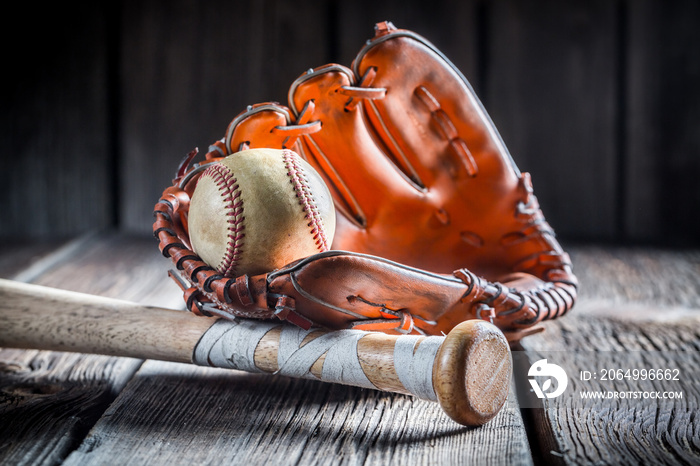 Vintage baseball ball and golden glove