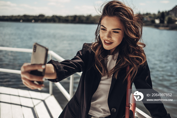 Fashion Portrait of Stylish Pretty Brunette Young Woman Outdoor