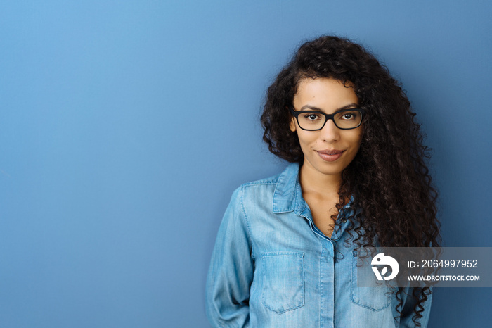 Thoughtful young woman wearing glasses