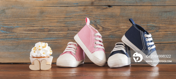 Delicious birthday сupcakes for a baby shower on wooden background