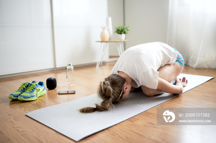 Woman stretching at home