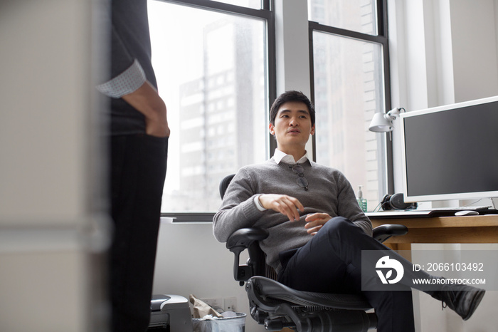 Two businessmen in office