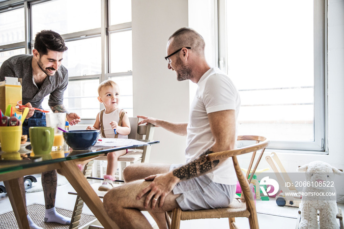 Fathers and daughter having breakfast at home