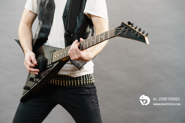 Man playing on electric guitar