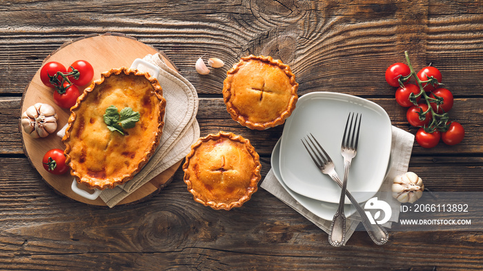 Tasty beef pot pies on table