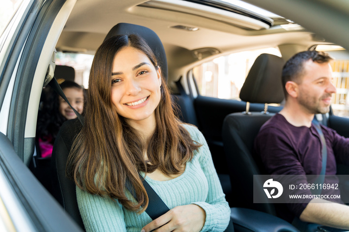 Happy Woman With Family In Car