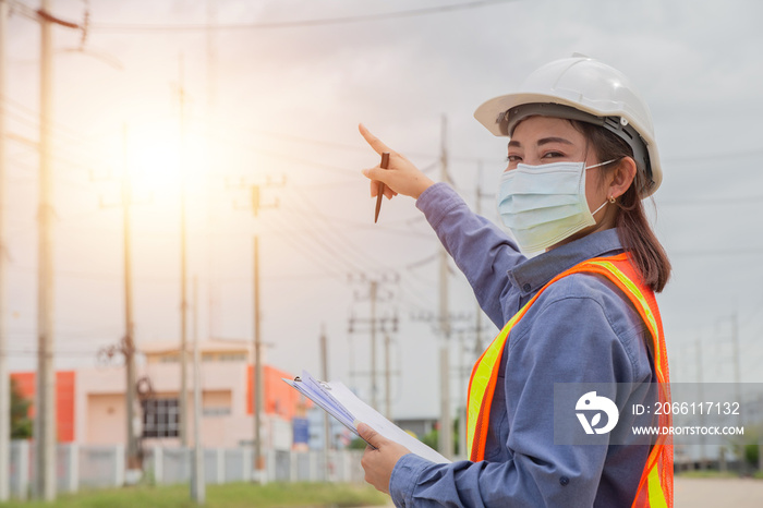 Asian women electrical engineer work on site service