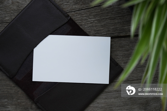 Business card mock up with card holder on old wooden table background