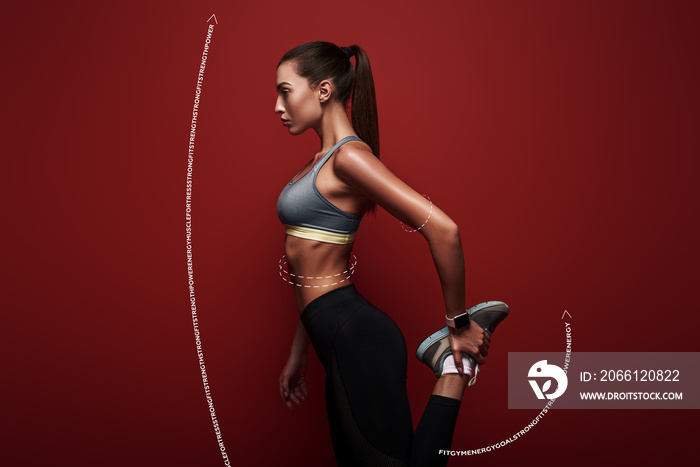 充满活力。女运动员站在红色背景上，伸展身体。绘图。