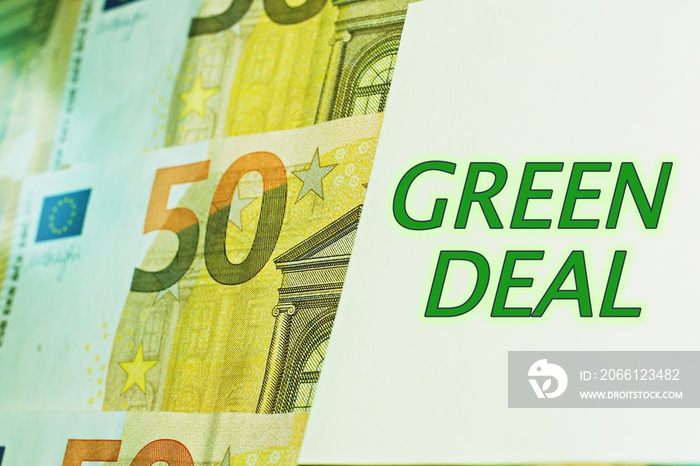 arrangement of 50 euros banknotes, sign reads in English, green deal