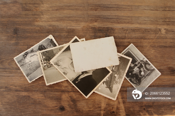 Retro some old photos on old natural wooden table