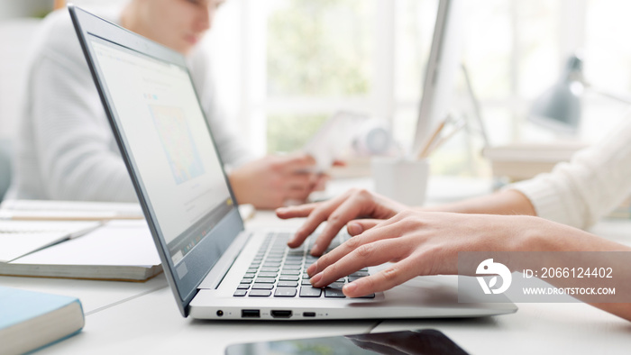 Woman using a laptop and connecting