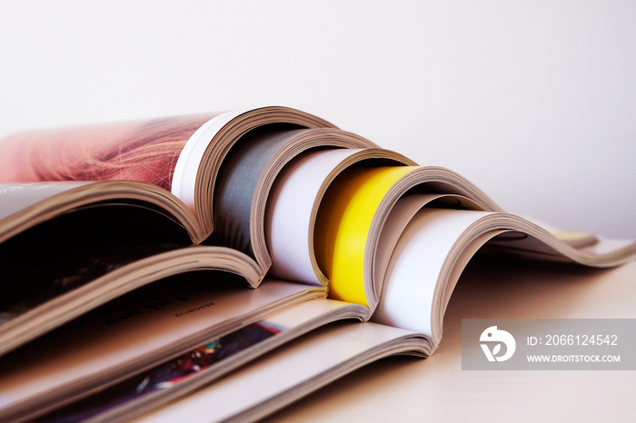 Stack of open magazines