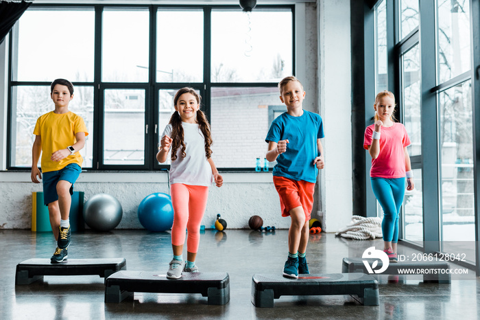 Active preteen children training with step platforms