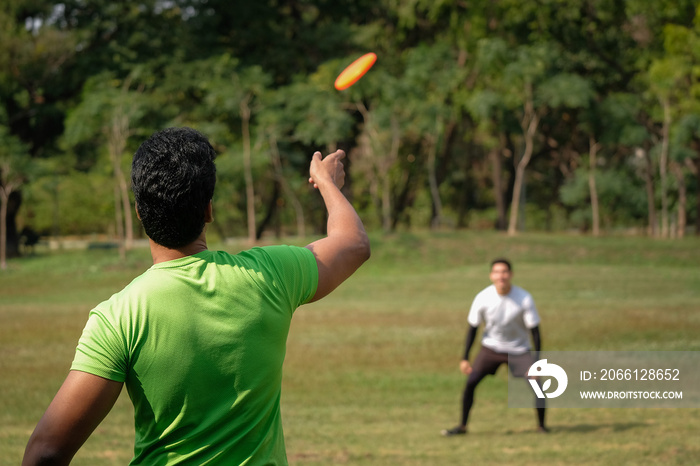 Young man playing frisbee in the park