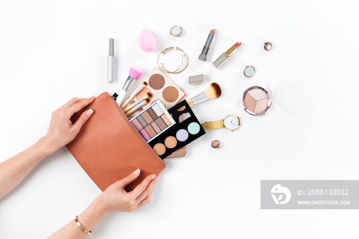 Makeup bag with cosmetic beauty products.