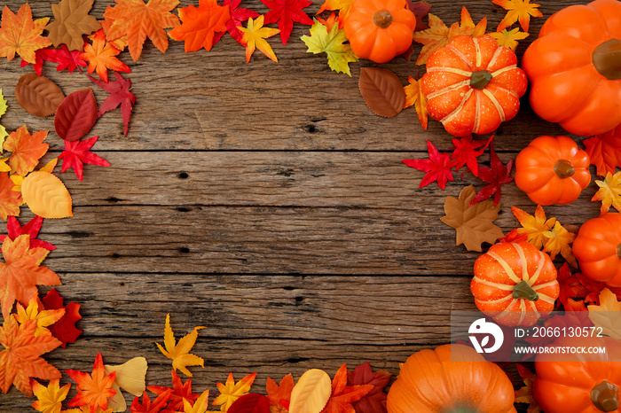 Autumn leaves on wooden background