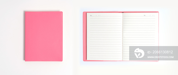 白色办公桌上的粉色笔记本。女性商务简约概念。平躺，俯视，复制空间